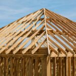 How to build a hip roof diagram showing common rafters raised first with the ridge board nailed in place between them